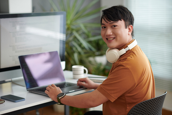 A web designer working on his laptop