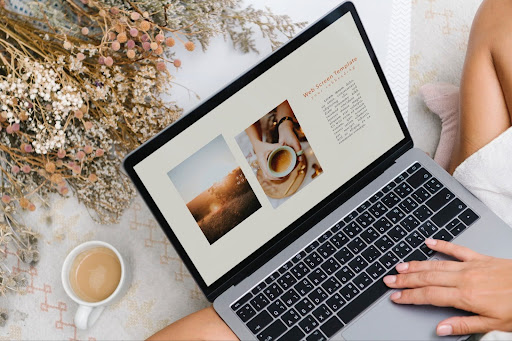 A person relaxing with a laptop showing a web design template A person relaxing with a laptop showing a web design template