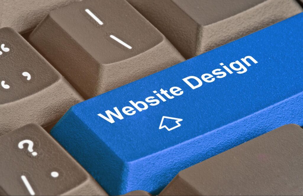 A close-up of a blue computer keyboard key labeled "Website Design" A close-up of a blue computer keyboard key labeled "Website Design"
