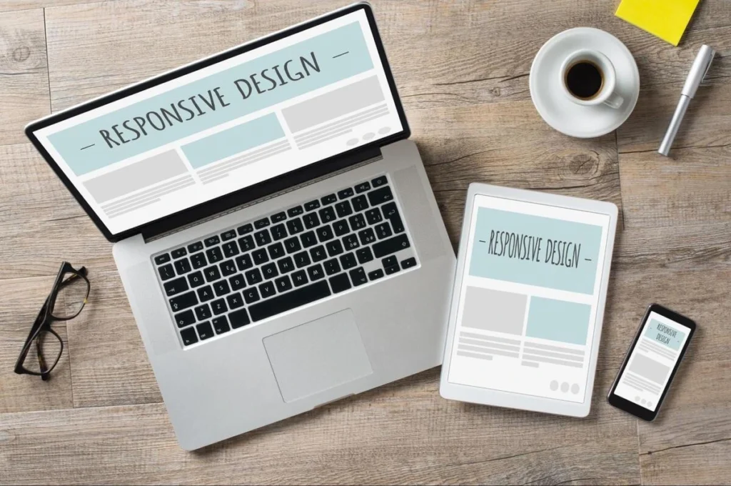 Laptop, tablet, and smartphone displaying a responsive website design layout